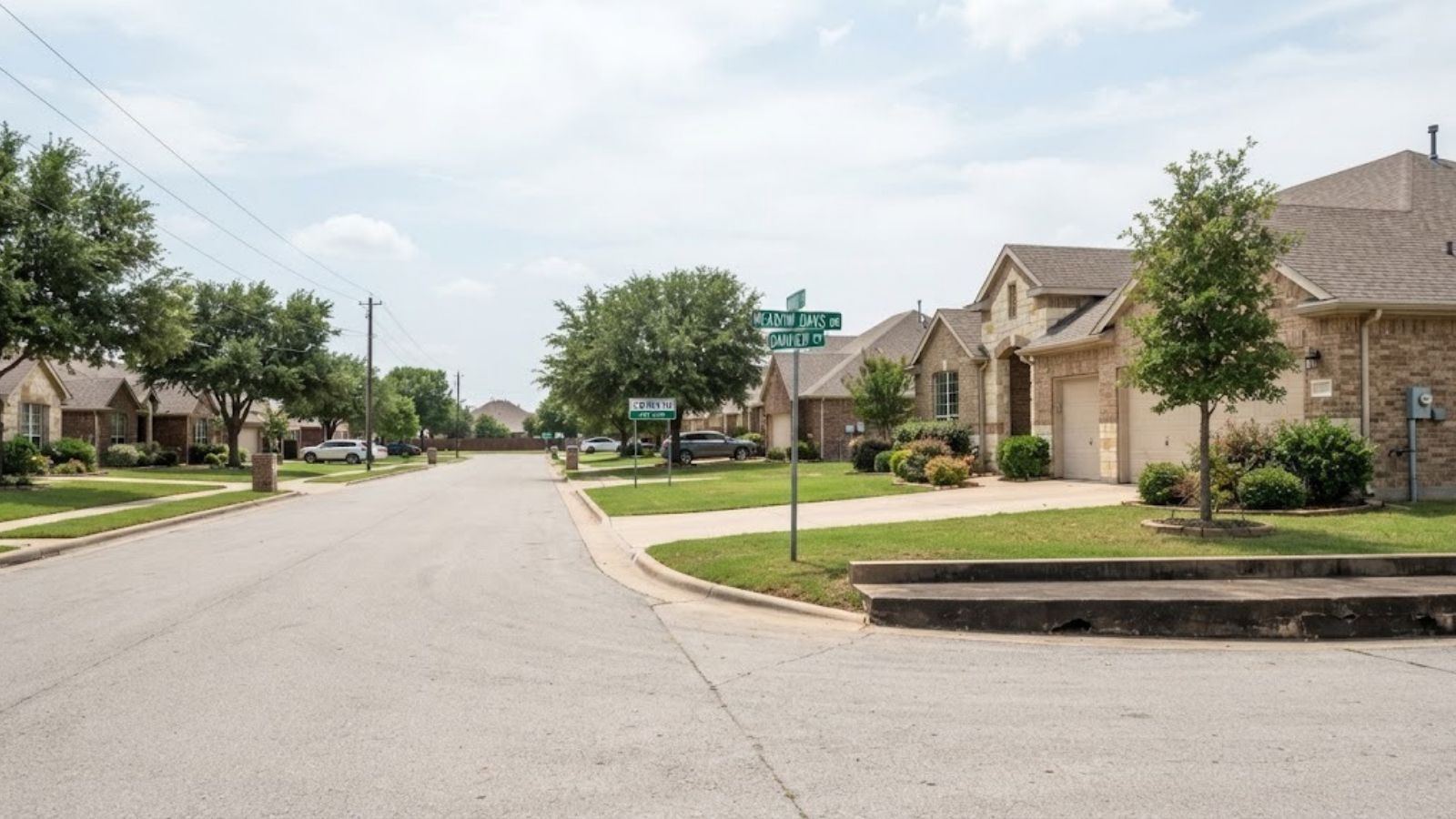 Suburban street of brick slab-on-grade homes, illustrating a Corinth, TX neighborhood